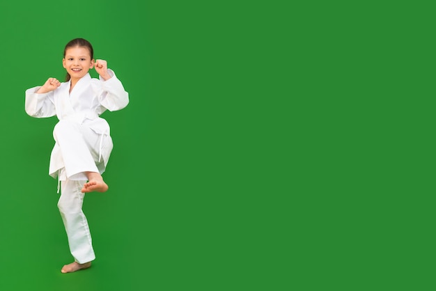 A child in a white kimono karate for child development