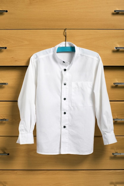 Child white shirt on blue hanger