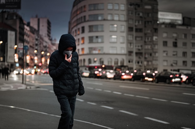 Child with Air Pollution Mask Traffic in the Background