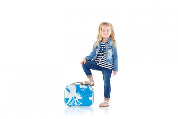 Child with blue suitcase