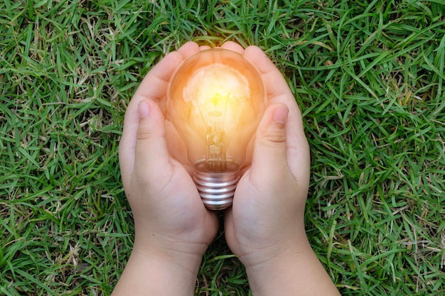 Child with a bright light bulb Concept of Ideas for presenting new ideas Great inspiration and innovation new beginning