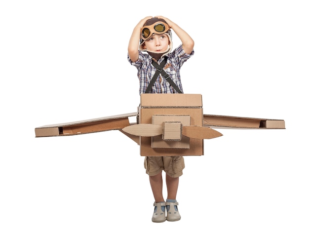 Child with cardboard airplane