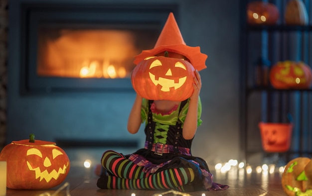 Child with carving pumpkin