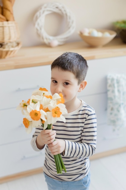 Child with daffodils and Easter decor