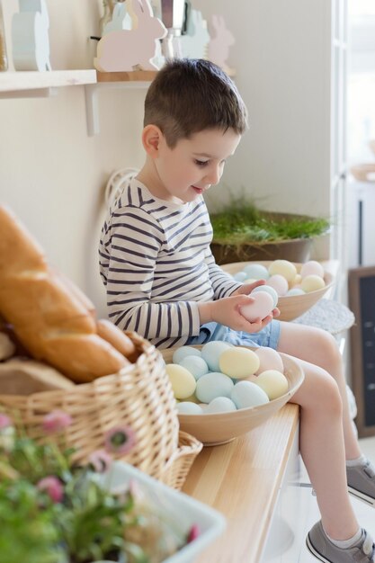 Child with Easter eggs and decor