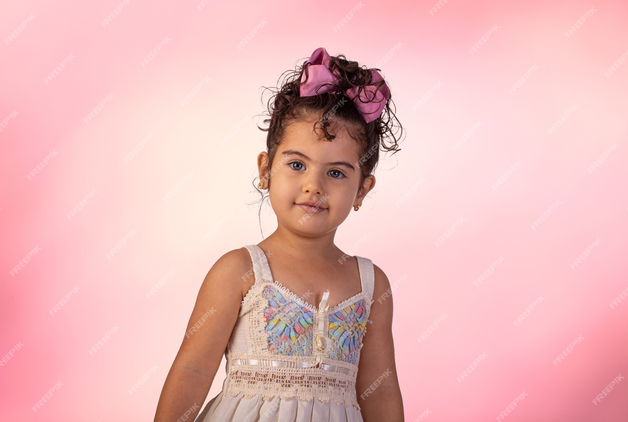 Premium Photo | Child with facial expressions in a studio photo over  colored background.