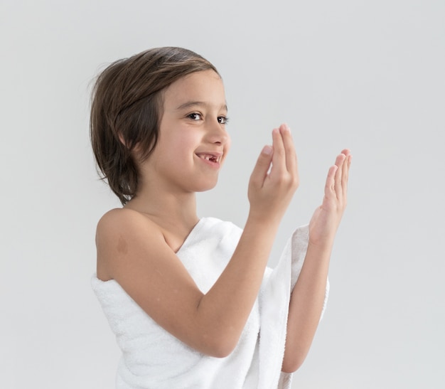 Child with Hajj pilgrimage clothes praying