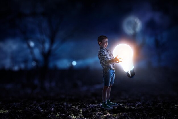 Child with a light bulb. Mixed media