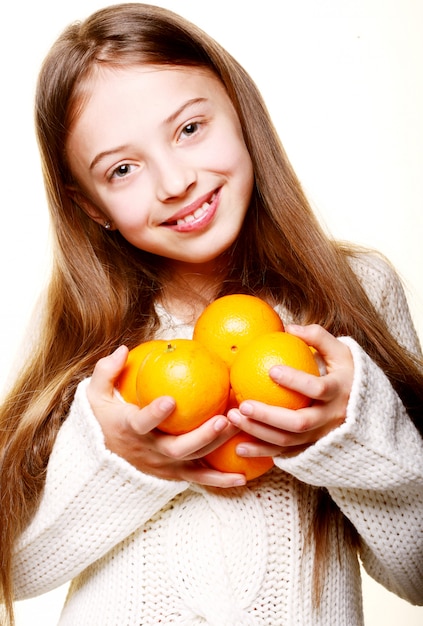 Child with an oranges