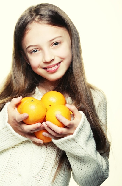 Child with an oranges