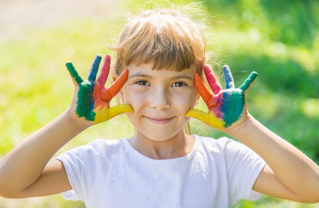 Child with painted hands and legs