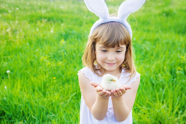 Child with rabbit ears. Easter. Selective focus.