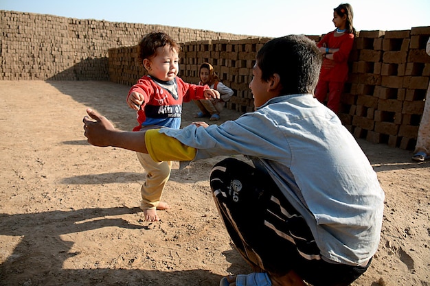 A child with a shirt that says'i'm a baby '