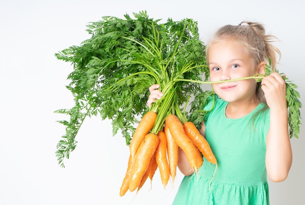 A child with a vegetable