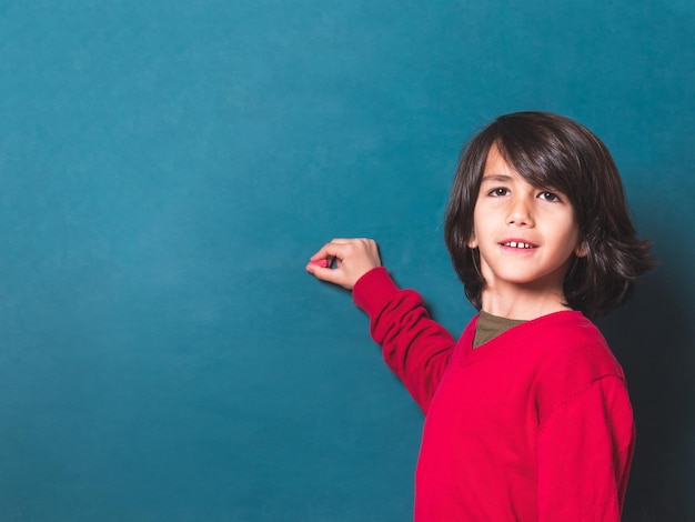 Child writing on the blackboard