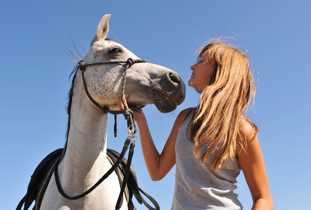 Child and young horse