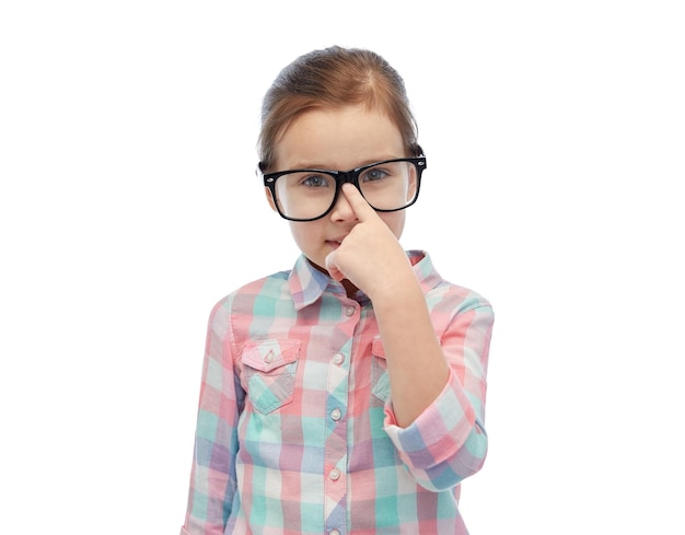 childhood, school, education, vision and people concept - happy little girl in eyeglasses