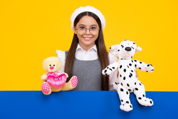 Childhood toys and kids Cute teen girl cuddling fluffy toy Happy face positive and smiling emotions of teenager girl