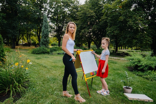 Children are engaged in outdoor lessons in the park.

