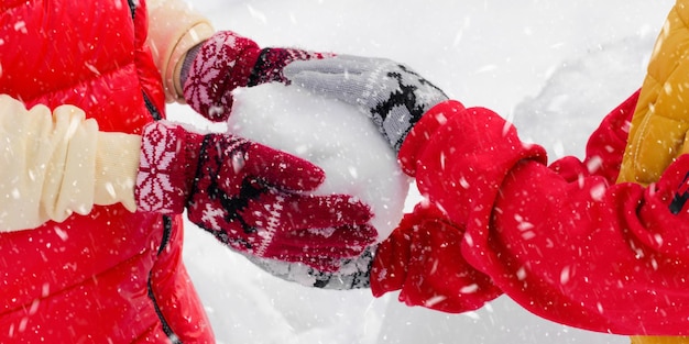 Children are holding a snowball