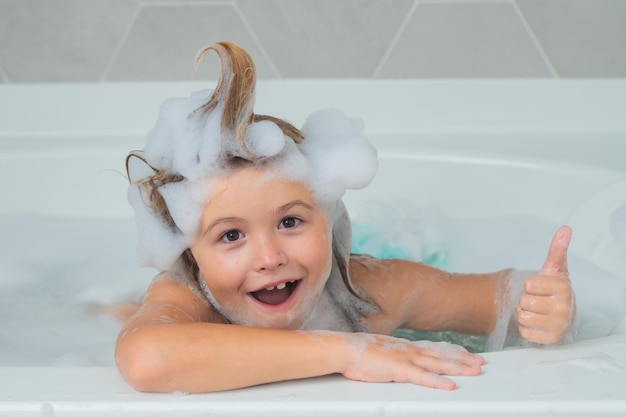 Children bathing kid bathes in a bath with foam