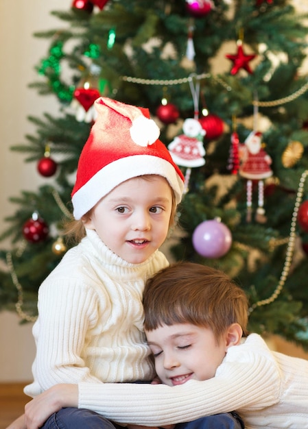 Children close to the Christmas tree