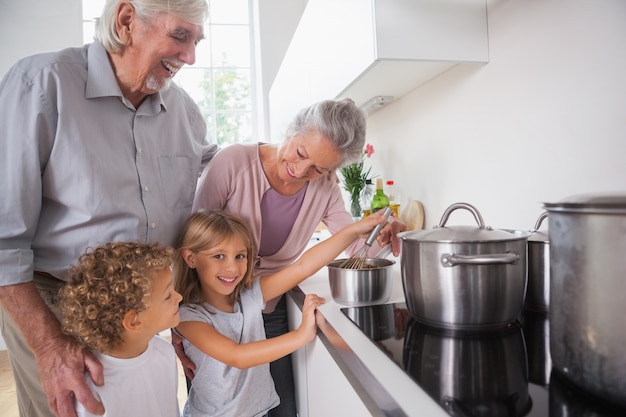 Children cooking with grandparents