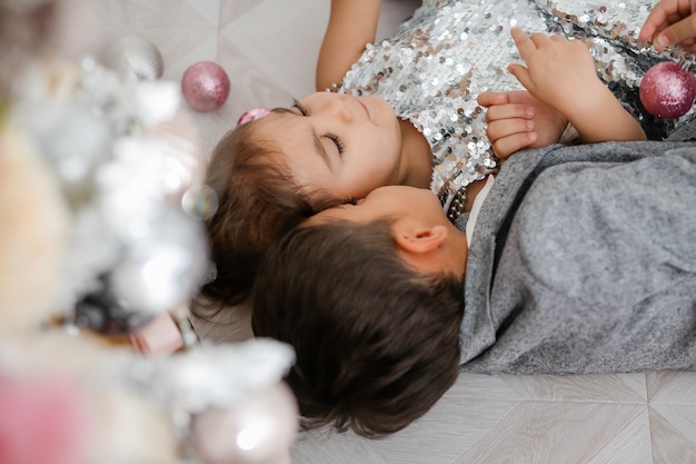 children decorate the Christmas tree