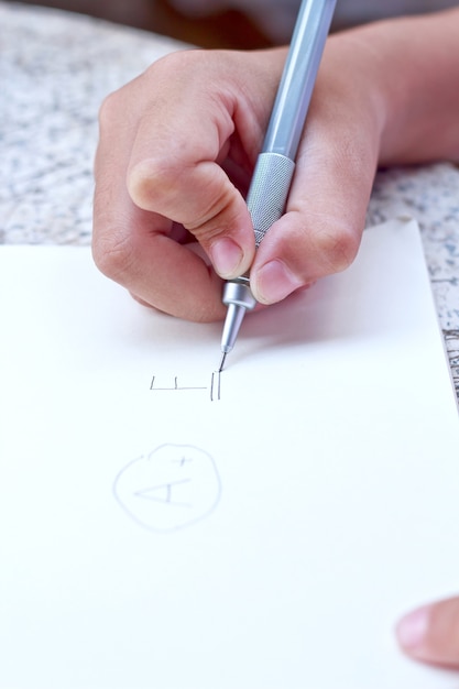 Children drawing on her note book.