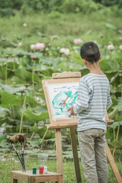 Children drawing natural coloring in the foreground.