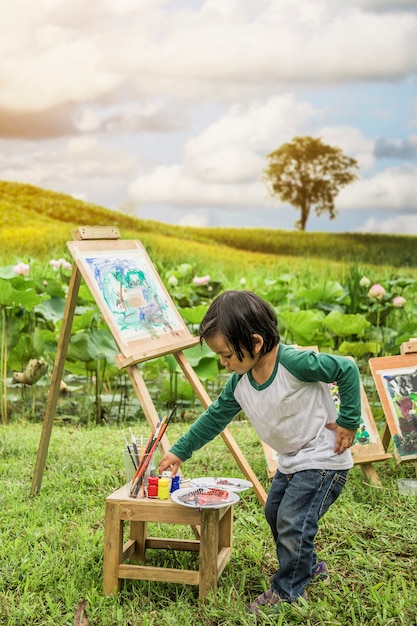 Children drawing natural coloring in the foreground.