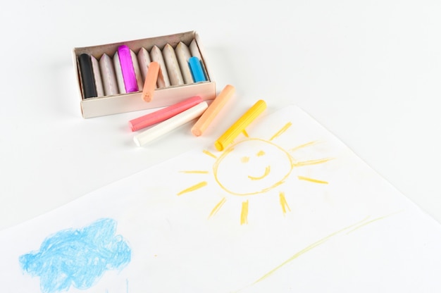 Children drawing pastel crayons.