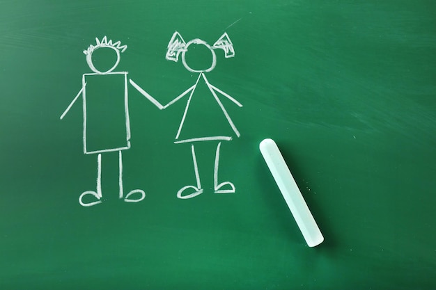 children drawings on school blackboard background