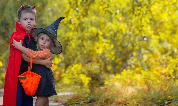 Children dressed in costumes for Halloween festive night Selective focus Halloween