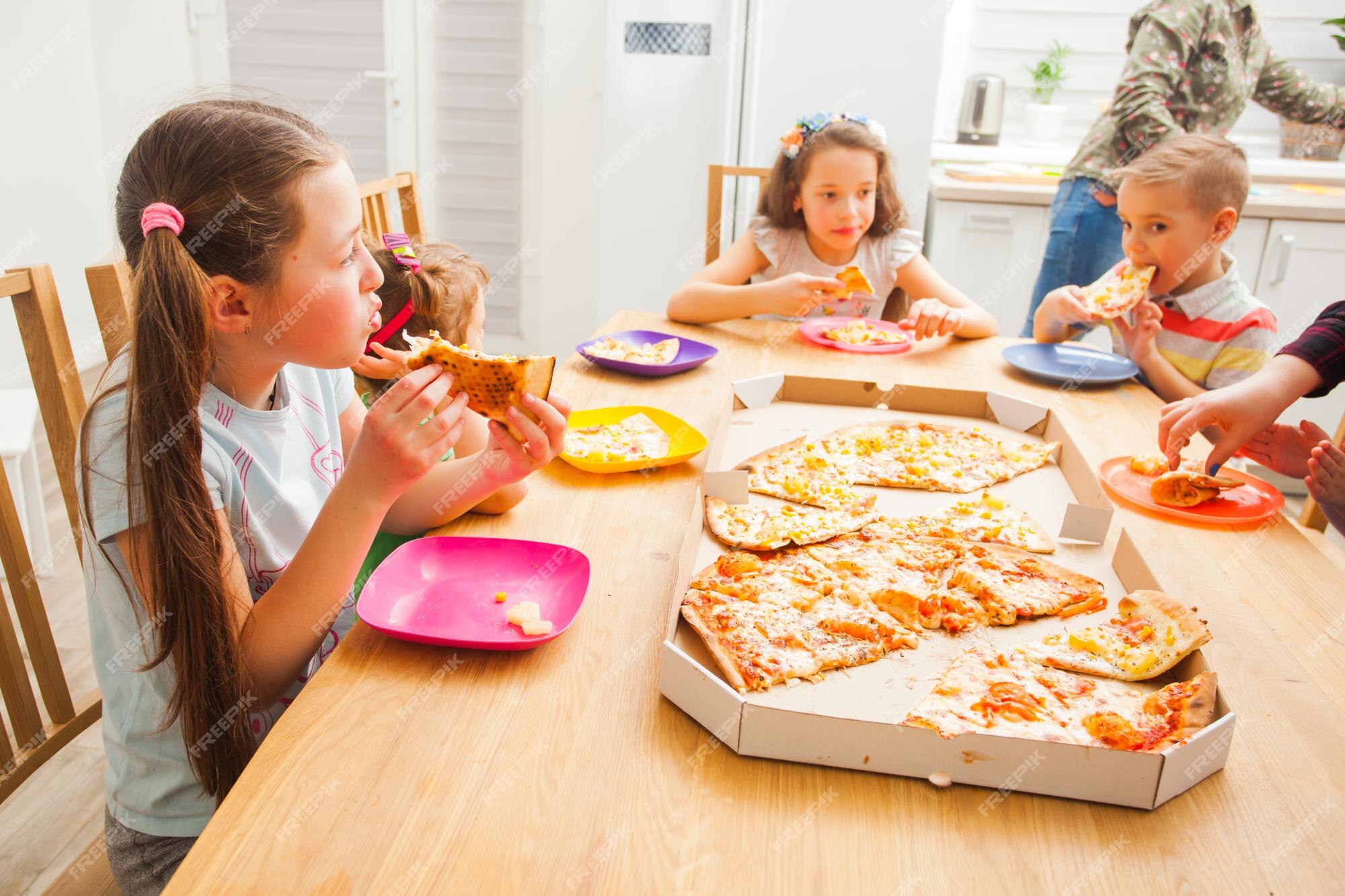 close-up image, A group of friends eating pizza in the party together. New  year party, Birthday party, Pizza party at home Stock Photo - Alamy