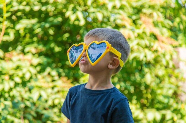 Children enjoy nature in glasses Selective focus