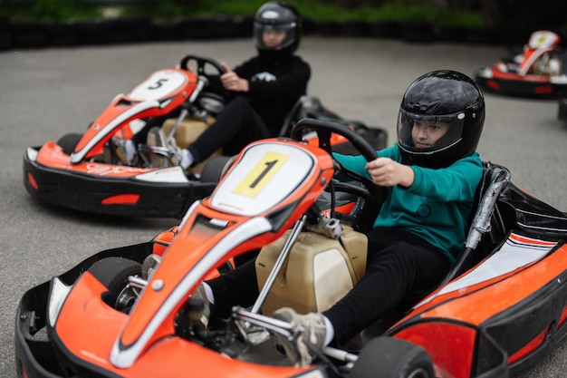 Children Enjoying GoKart Racing Outdoors for a Fun and Exciting Adventure
