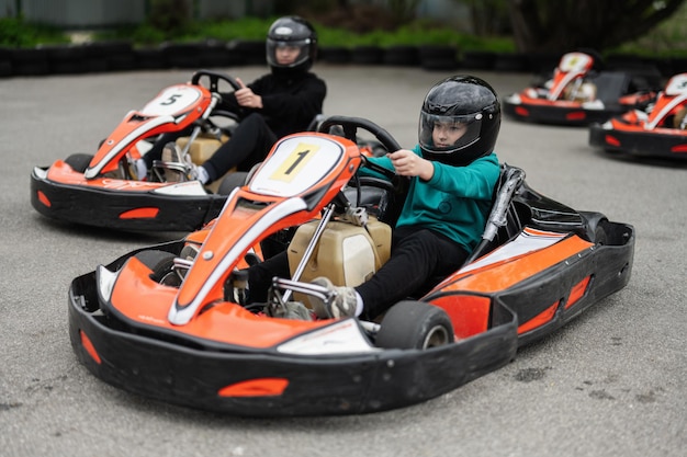 Children Enjoying GoKart Racing Outdoors for a Fun and Exciting Adventure
