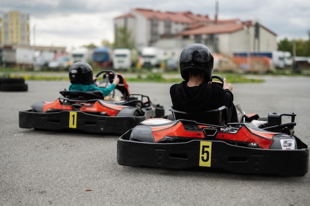 Children Enjoying GoKart Racing Outdoors for a Fun and Exciting Adventure