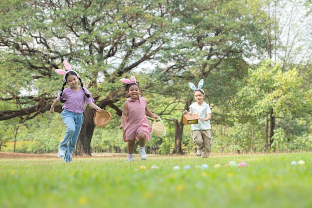 Children enjoying outdoor activities in the park including a run to collect beautiful Easter eggs