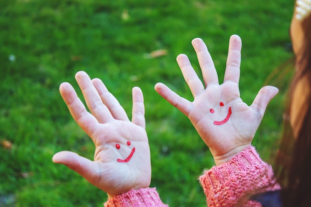 Children hands in colors. Summer photo. Selective focus.