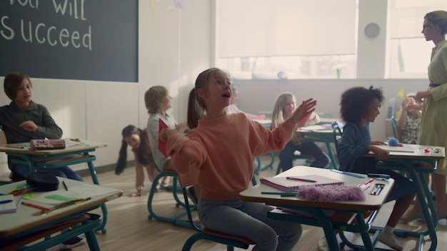 Children having fun in classroom Mixed race pupils playing with paper planes