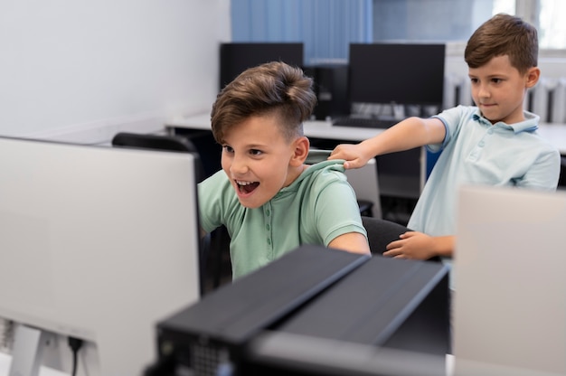 Children having technology education class