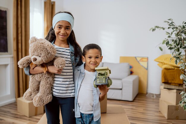 Children hold their favorite toys in their hands and embrace each other