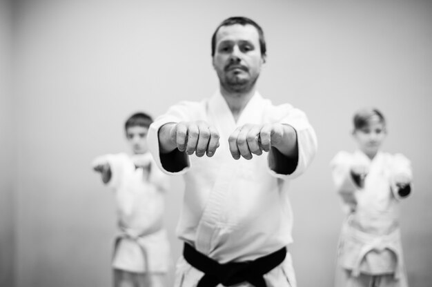 Photo children in kimono begin training on aikido.