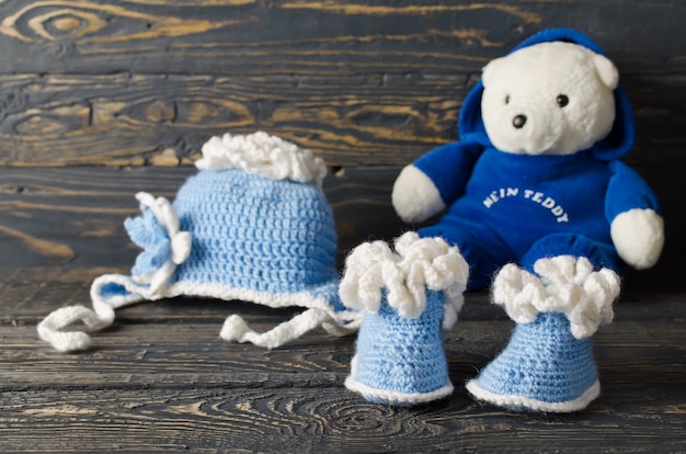 Children knitted garments for the boy. Hat and booties