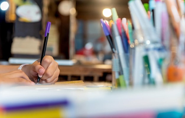 children learn coloring and painting in classroom. education and creative art for kid.