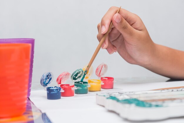 Children learn coloring and painting in classroom.