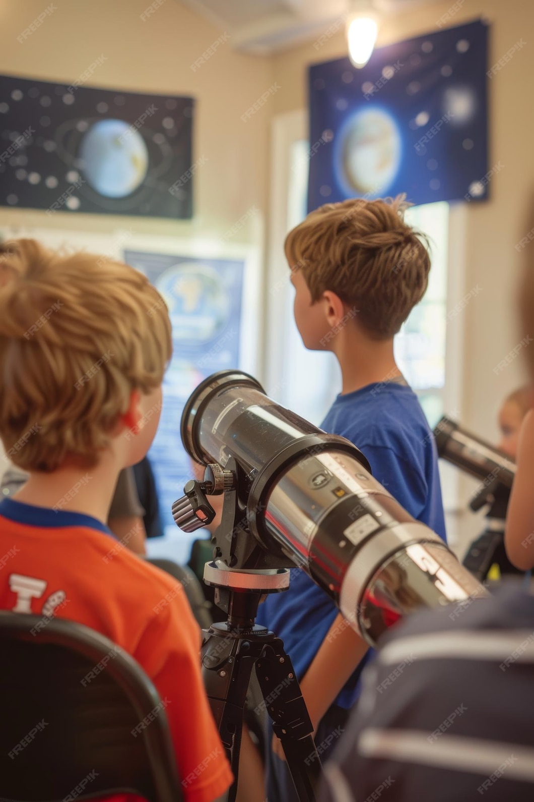 Children Learning Astronomy with Telescopes in Classroom Planetarium