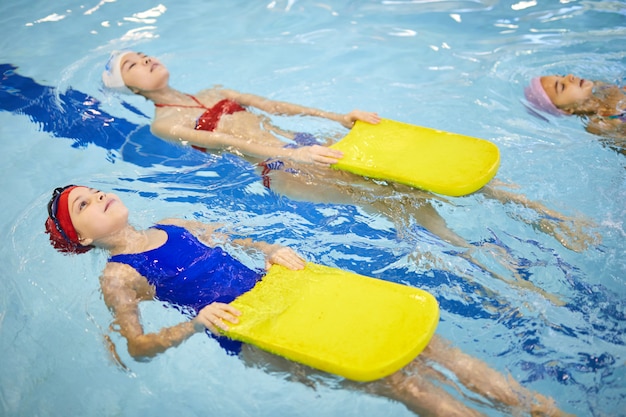 Children learning to swim